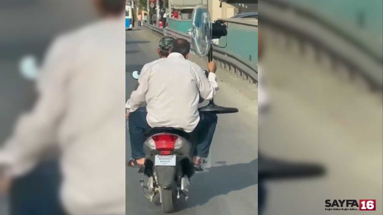 Bursa'da hayretlik görüntü!! Trafikte ilerleyen klimalı bisiklet