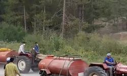 Çiftçi Bursa'daki yangına patlayan tekerlekle gitti